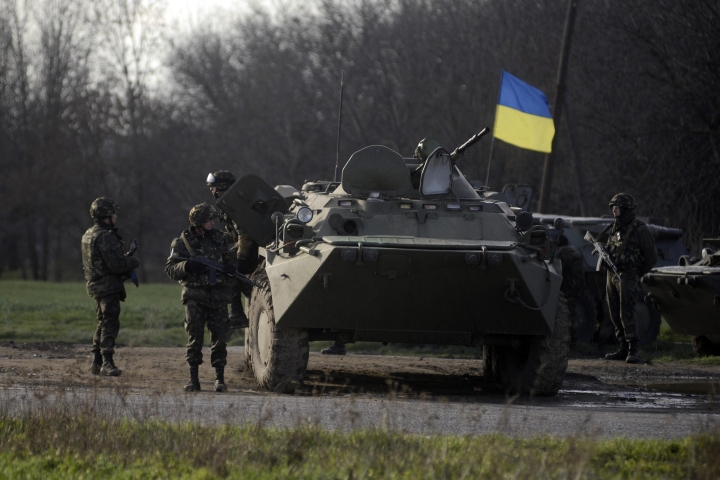 Ukranian troops stand guard at a checkpoint near the city of Izium in the Kharkiv region of east Ukraine