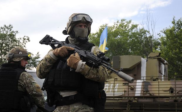 Ukrainian servicemen stand at the military camp near the town of Svyatogorsk