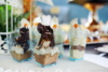 Chocolate Desserts In Parfait Cups On A White Table, Decor With