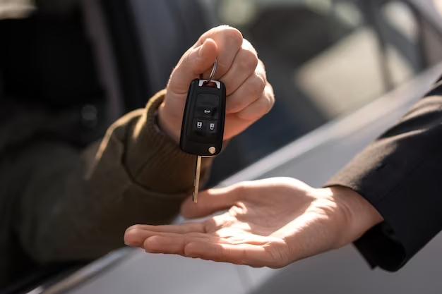 side-view-hands-holding-car-key_23-2150320970