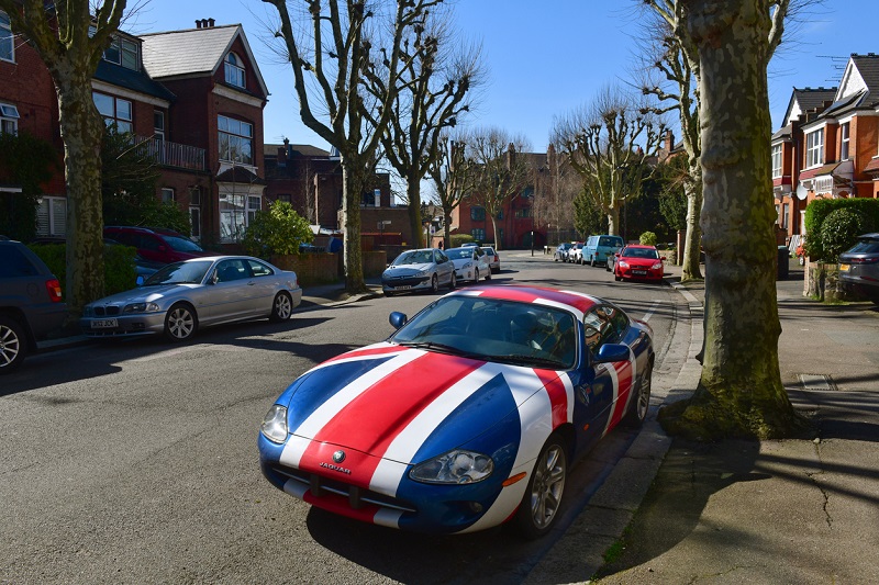 London street with Jaguar car